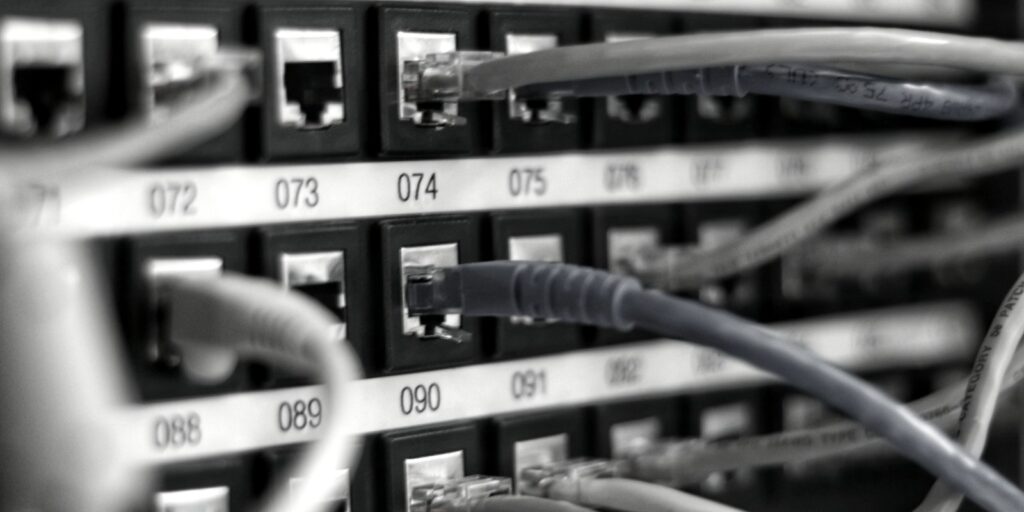 Close-up of a network patch panel with cables
