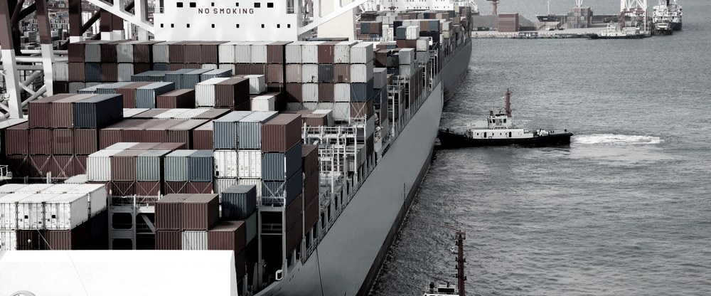Shipping containers stacked at a commercial port